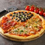 Pizza vier Jahreszeiten mit Tomaten und 5 weiteren klassischen Zutaten ist nach wie vor top.