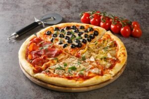 Pizza vier Jahreszeiten mit Tomaten und 5 weiteren klassischen Zutaten ist nach wie vor top.